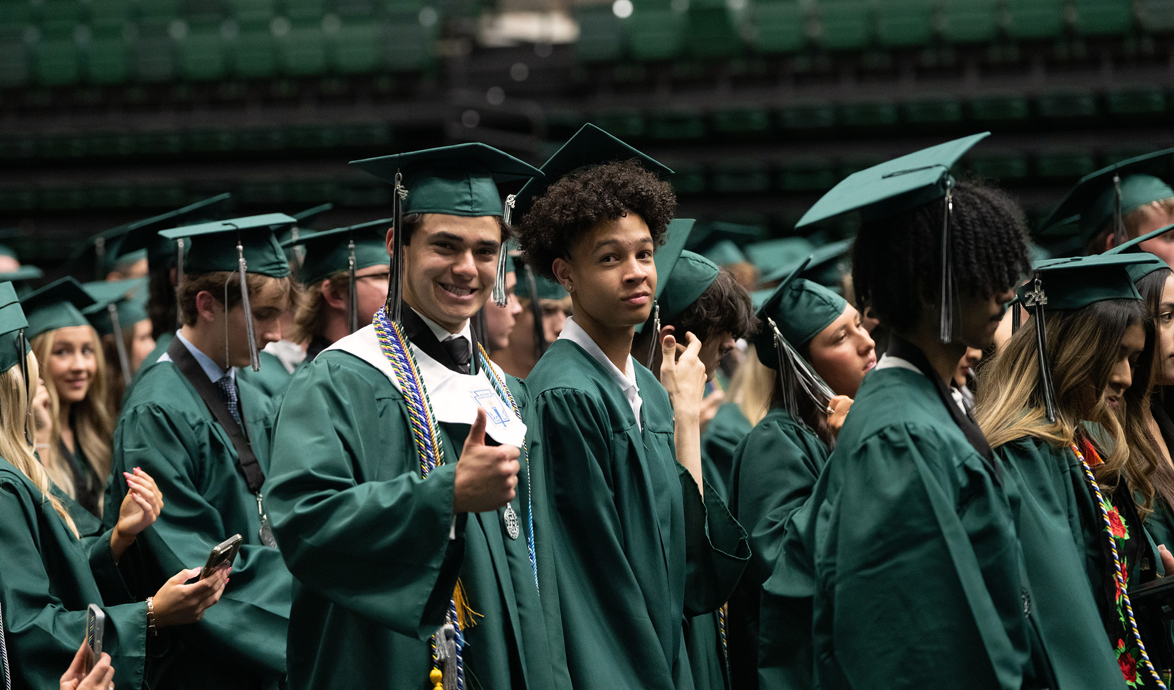 Fossil Ridge grads give the thumbs up at the ceremony. 