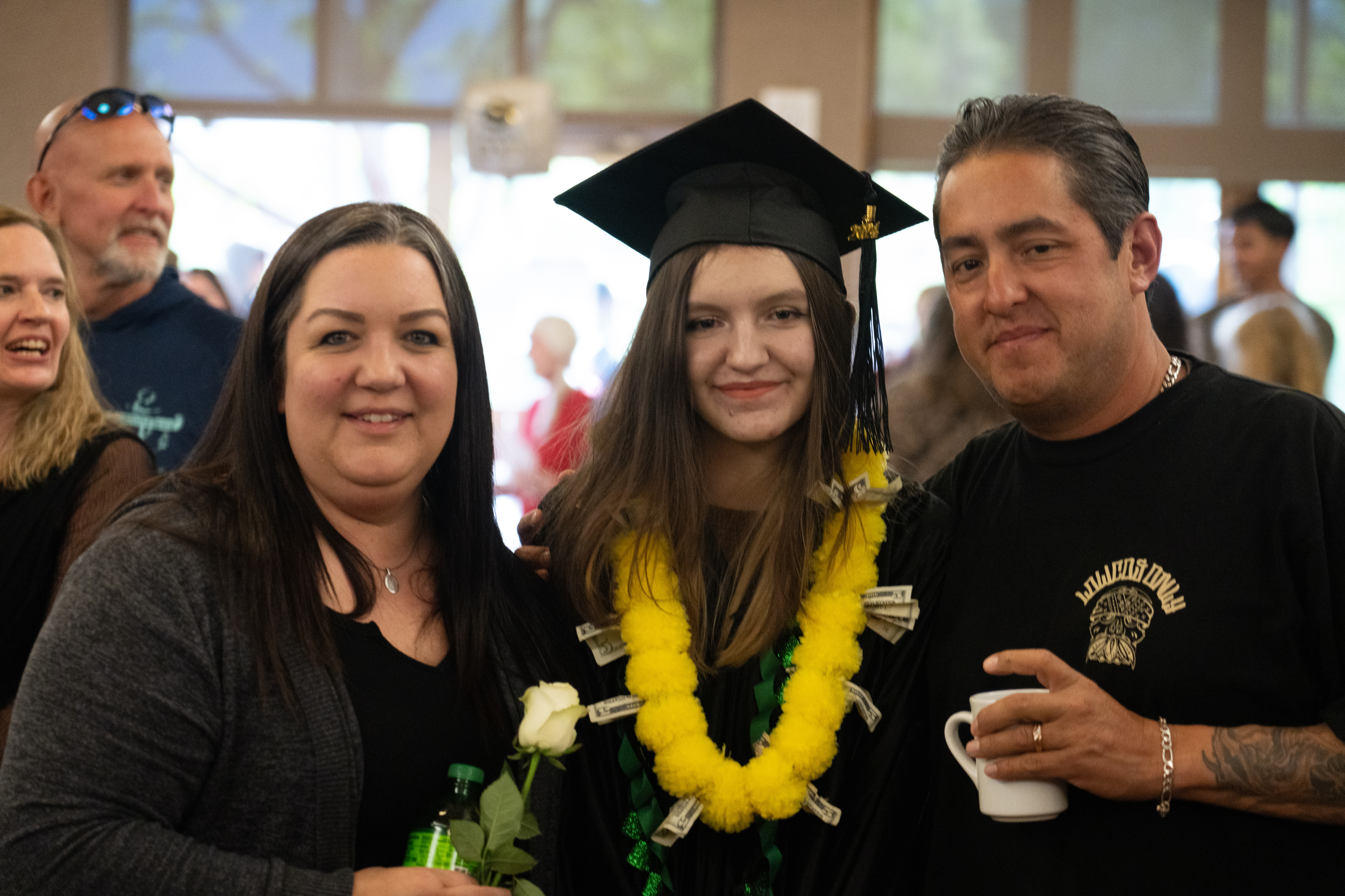 Opportunities Unlimited graduate with two family members.