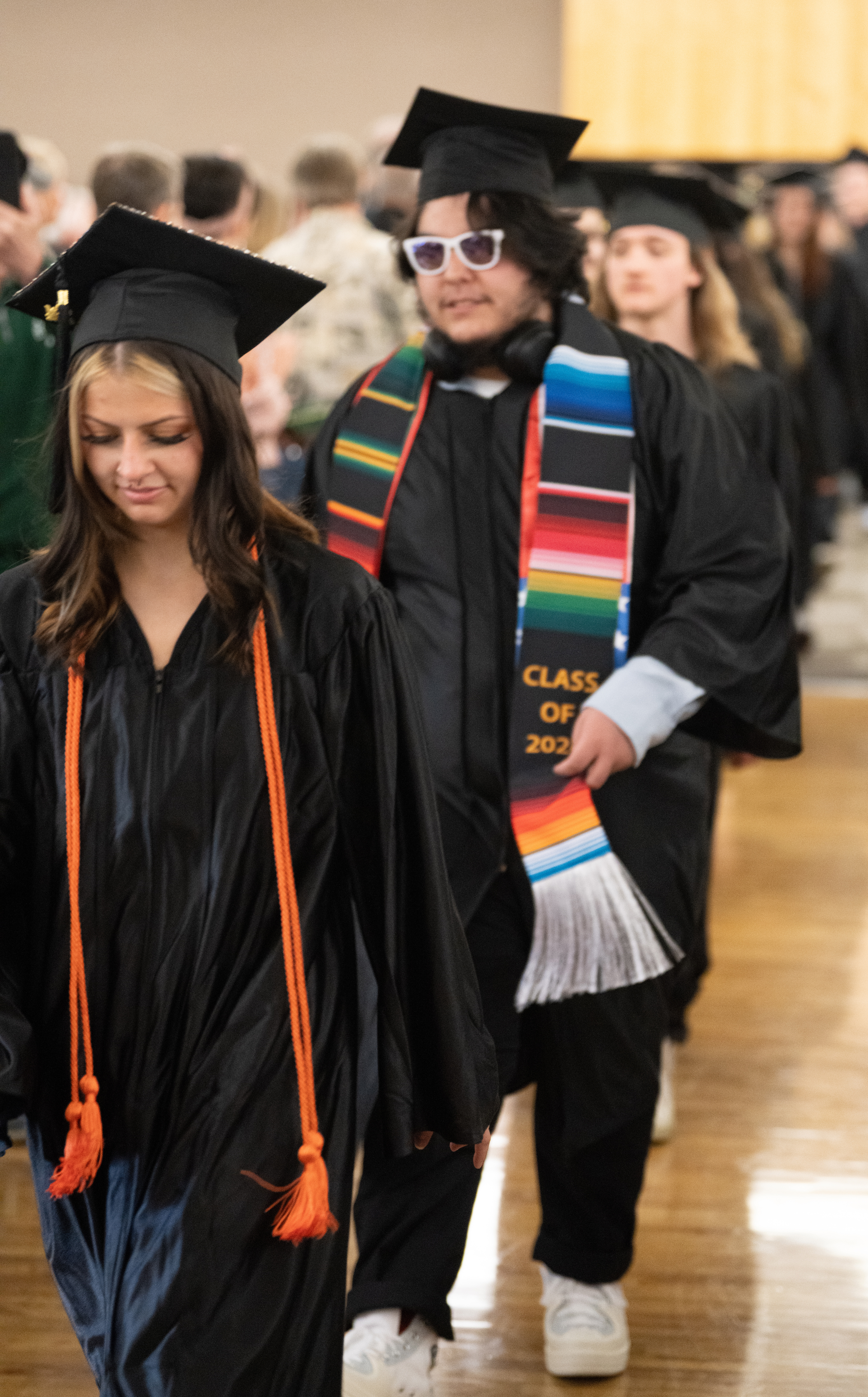 Opportunities Unlimited graduates walk in to graduate.