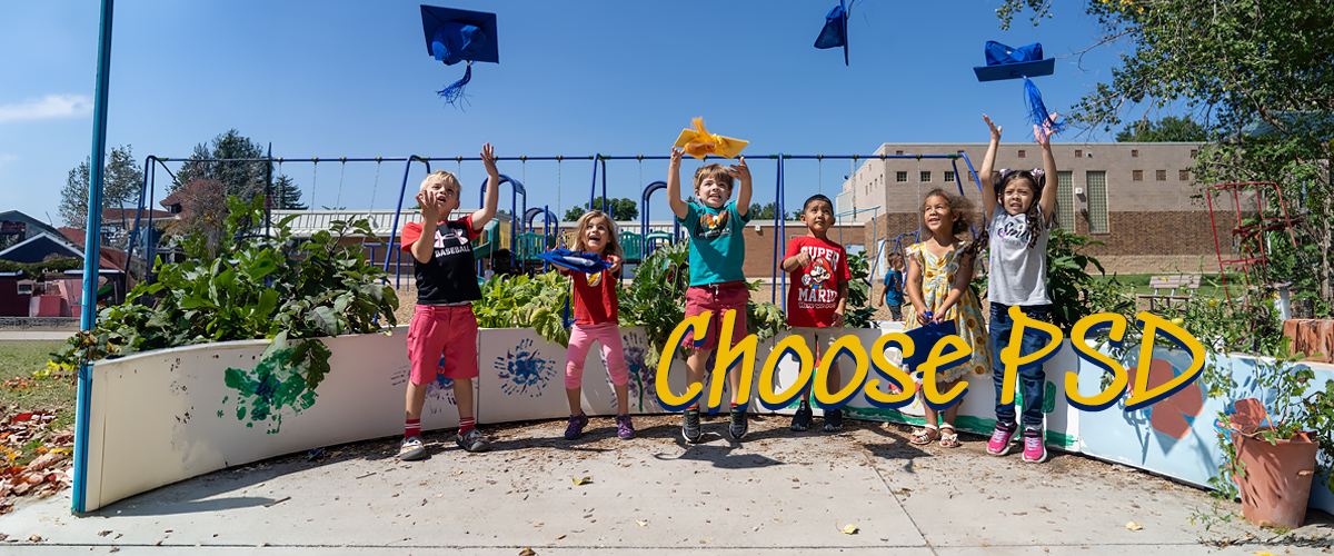 Kindergarteners jump and throw graduation caps in the air.