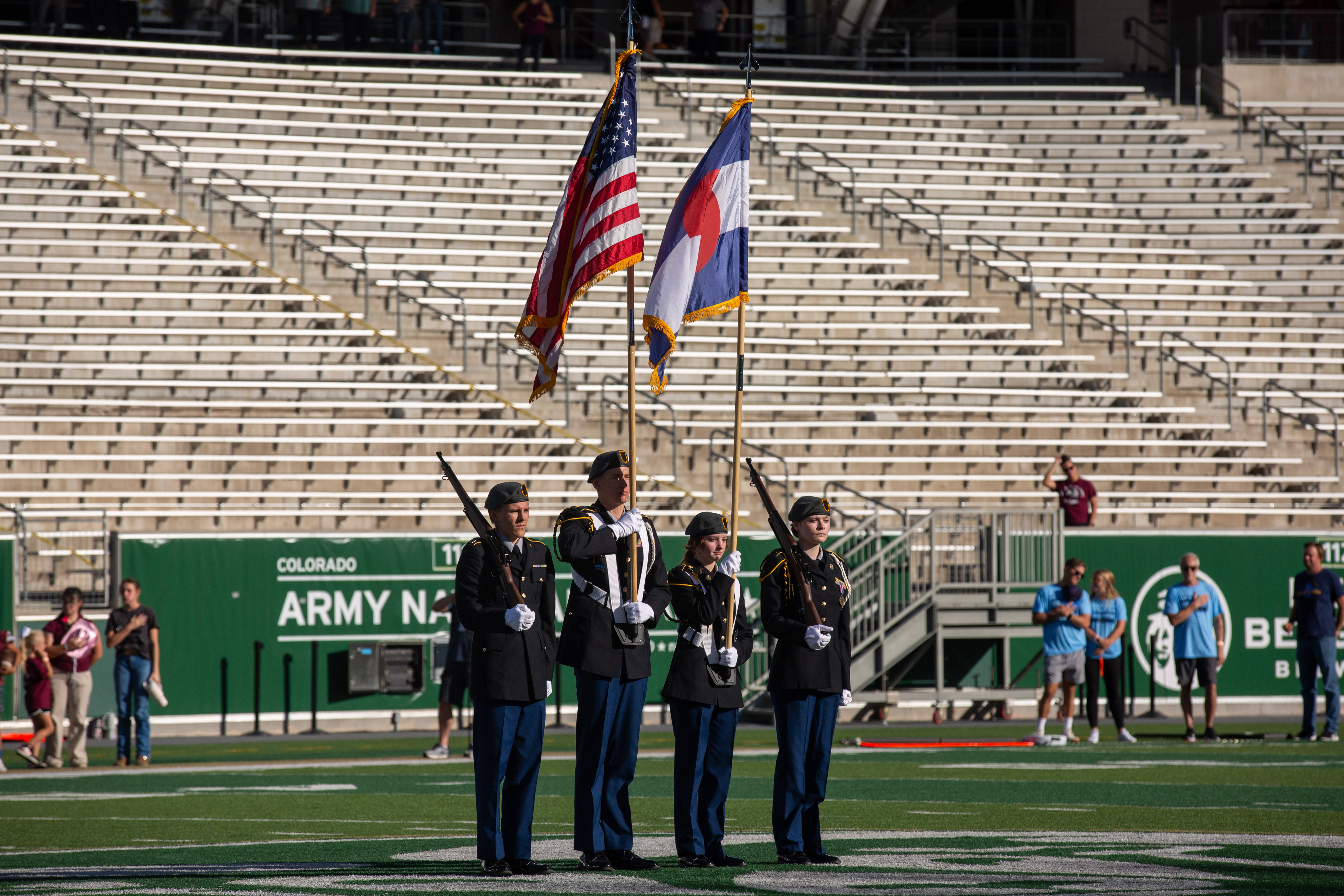 The color guard presents the flags.