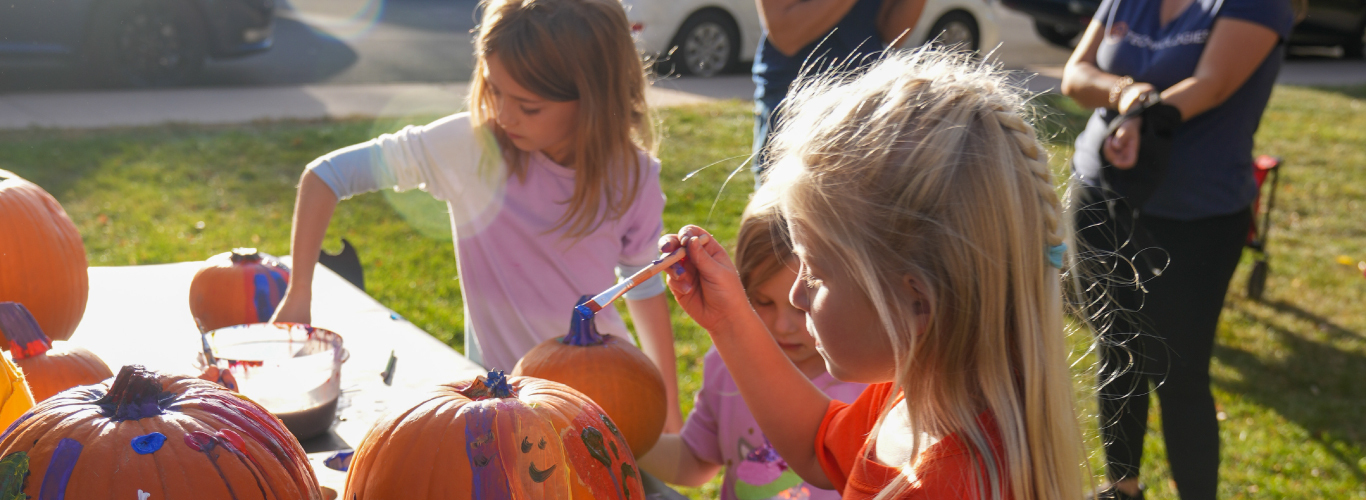 Students painting pumpkins