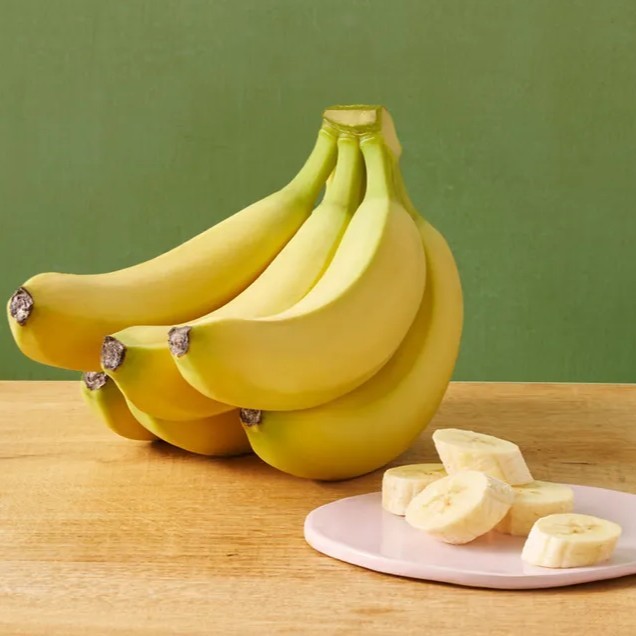 bunch of bananas and a plate with banana slices