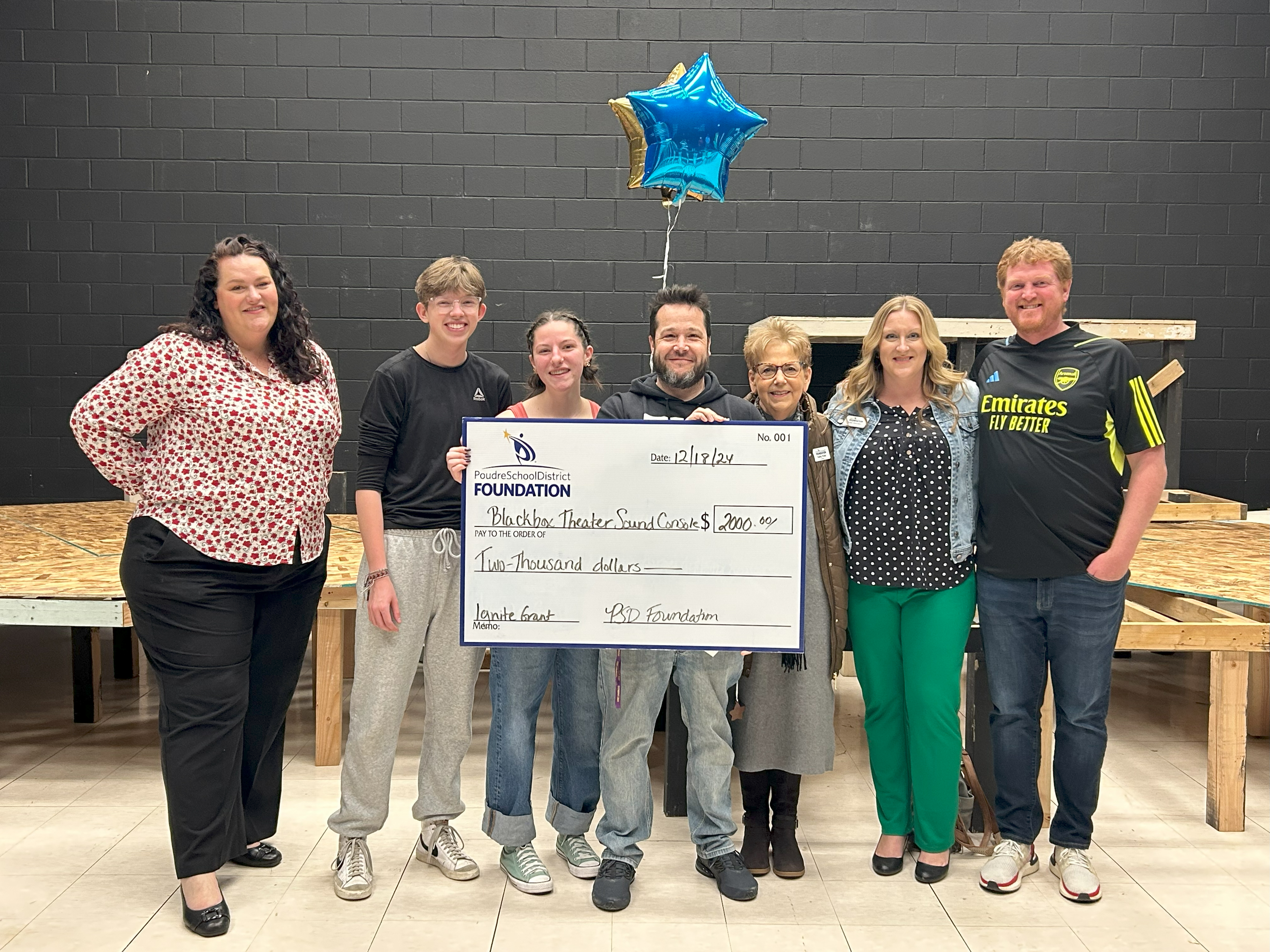 Fort Collins High School staff receive a grant for the theater. 