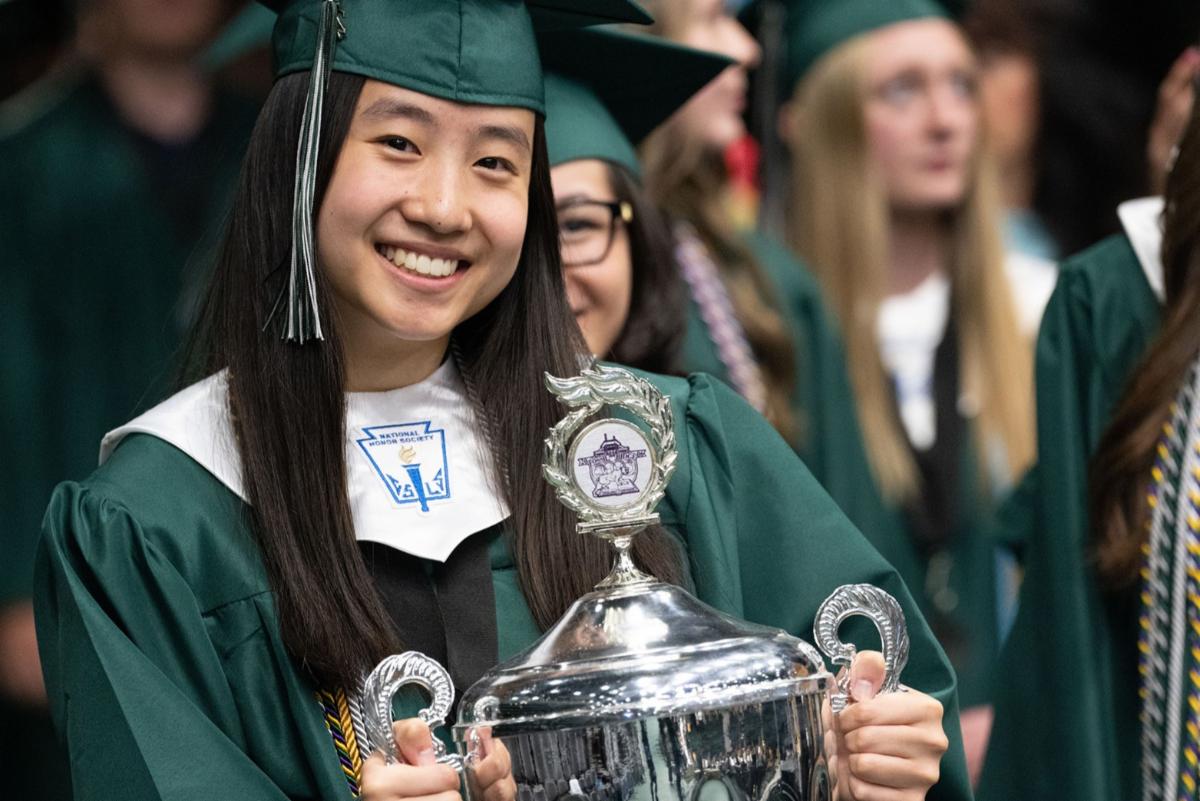 A PSD graduate smiles at the camera.