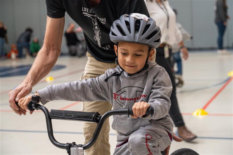 A Linton Elementary student on a bike.