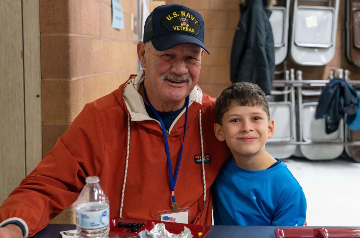 A veteran with a Werner Elementary student at their breakfast.