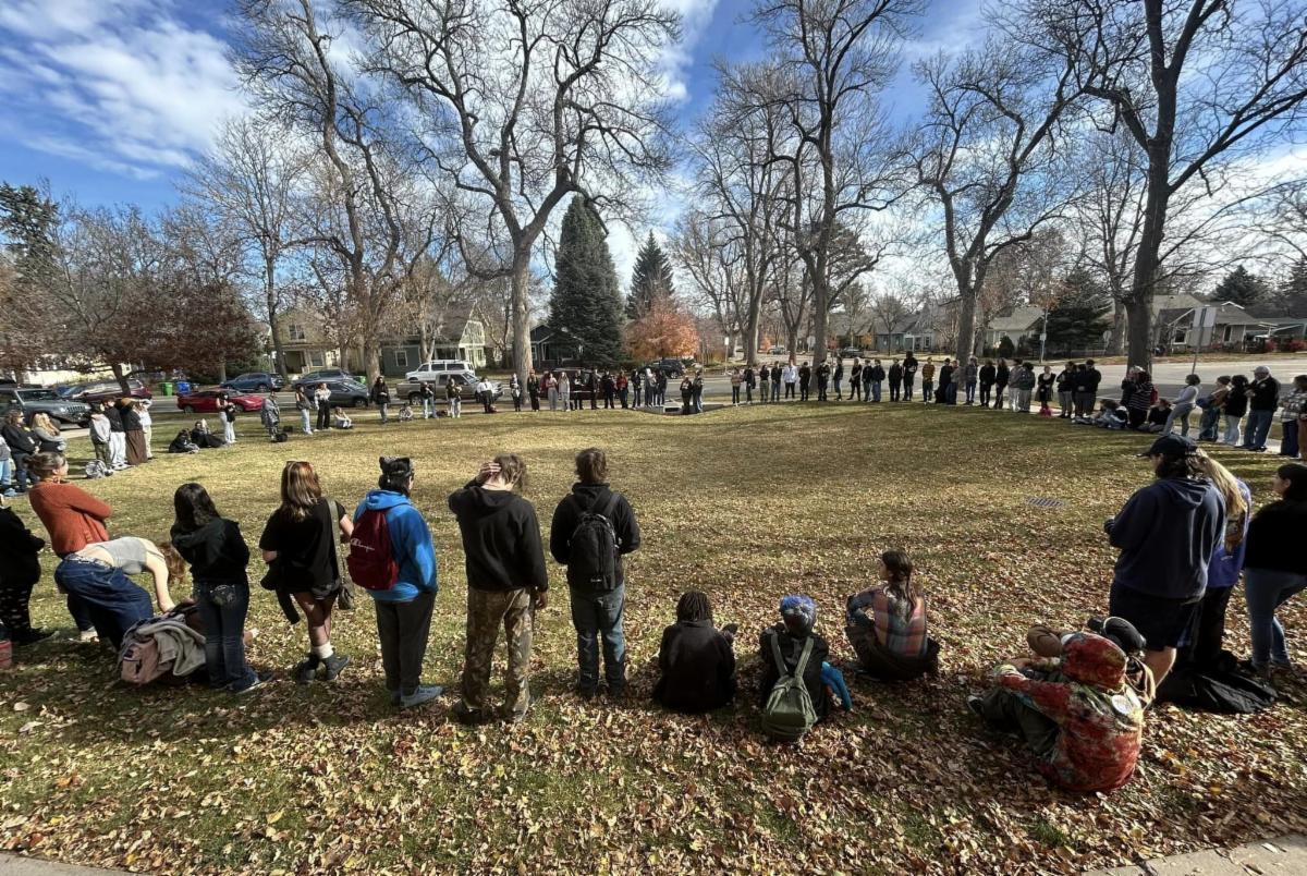 Centennial High School students outside in a circle. 