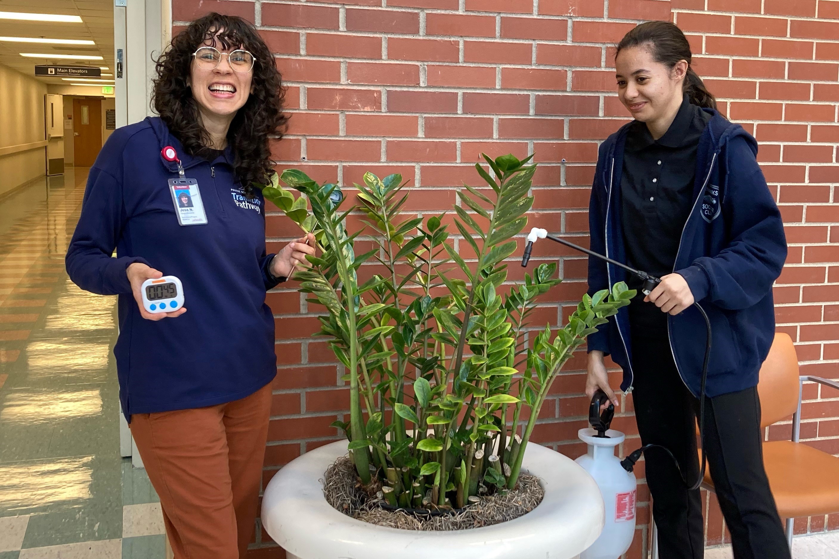 Jess Narvaez, Project SEARCH paraprofessional, with a colleague.