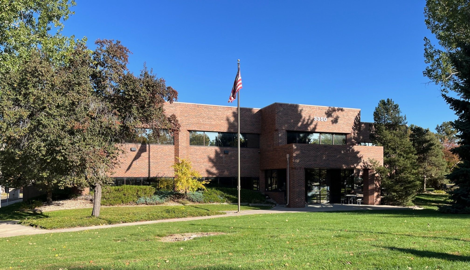 Outside of building with trees and flag pole