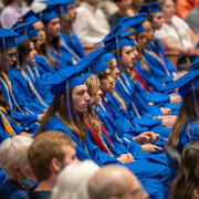 PHS IB graduates sit in the auditorium. 