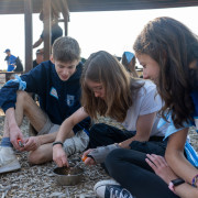 Students work together during an outdoor activity at the Peer Summit.