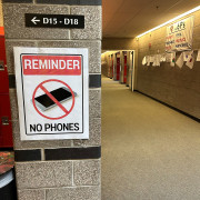 A poster reminding kids not to use cell phones at school.