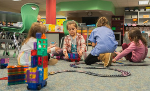 School-aged children playing with educational toys